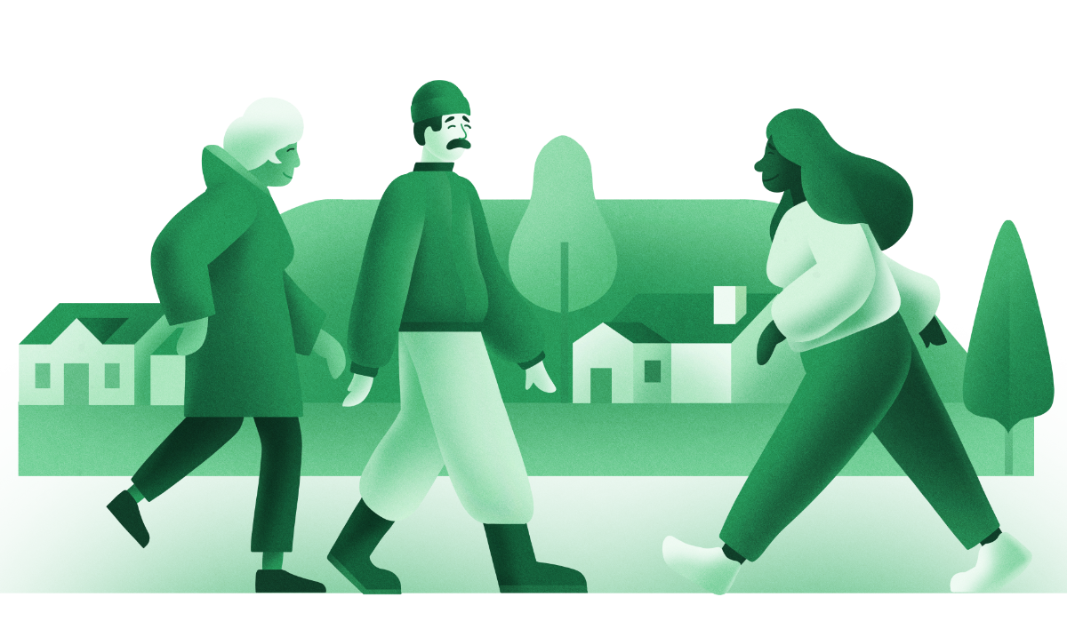 Three people walking together in front of some houses and trees